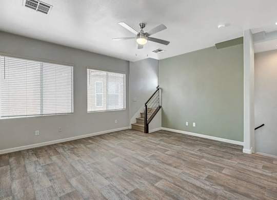 A room with a staircase and a ceiling fan. at Habitat @ DTLV, Las Vegas, NV