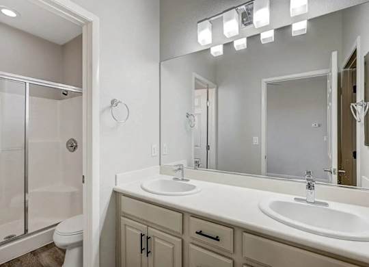A bathroom with a white sink and a mirror. at Habitat @ DTLV, Las Vegas, NV, 89106