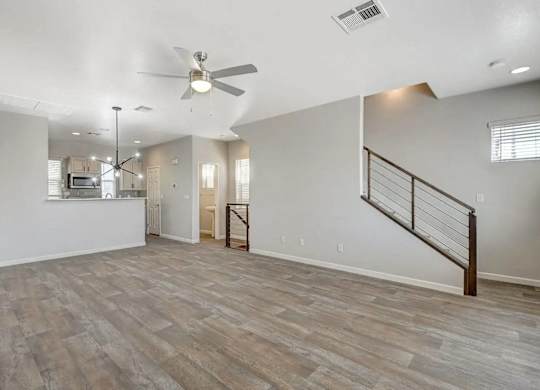 A spacious room with a ceiling fan and lighting fixtures. at Habitat @ DTLV, Nevada, 89106