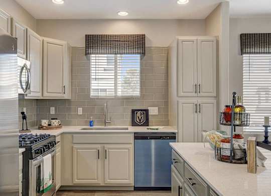 A kitchen with a stove top oven and a dishwasher. at Habitat @ DTLV, Nevada