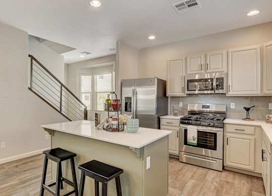 A kitchen with a stainless steel refrigerator, oven, and microwave. at Habitat @ DTLV, Las Vegas, NV, 89106