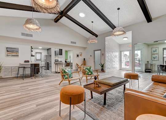 A modern living room with a wooden floor and furniture.