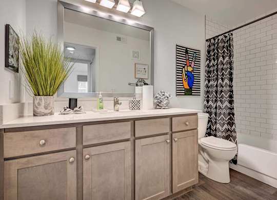 A bathroom with a white toilet and a white sink.