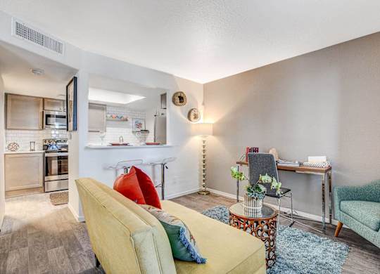 Living Room With Kitchen View at The 95 Apartments, Las Vegas, NV