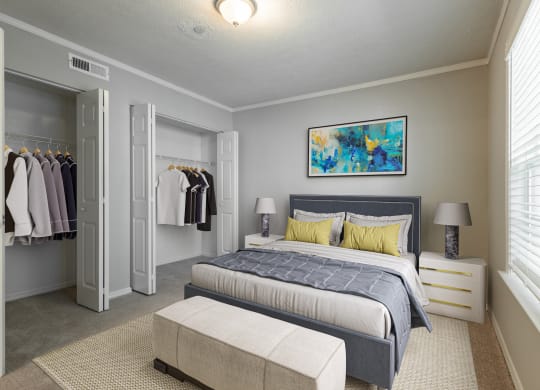 a bedroom with a large bed and a walk in closet