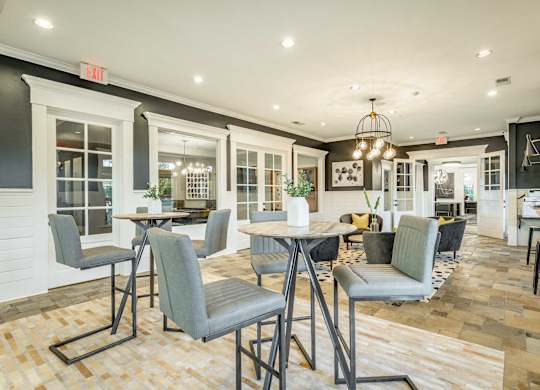 A dining area with a table and chairs.