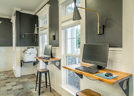 A room with a desk and a computer.
