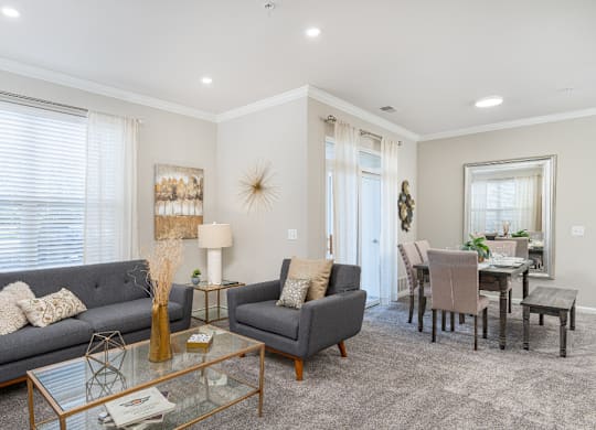 a living room with two couches and a glass table at Bristol Station, Naperville, Illinois