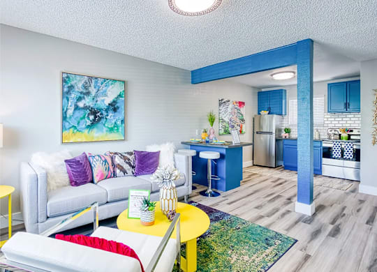 Fusion Las Vegas 1 bedroom apartments in Vegas living room with a white couch and a yellow coffee table.