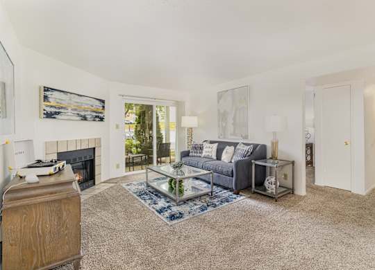 A living room with a fireplace and a couch.