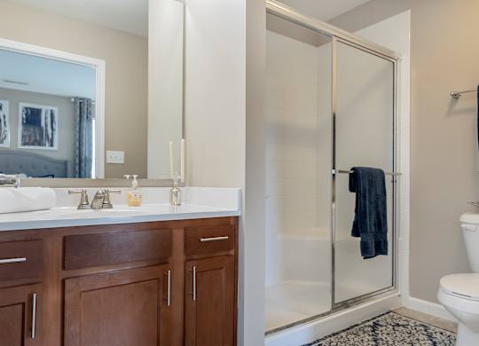 A bathroom with a white sink and a toilet.