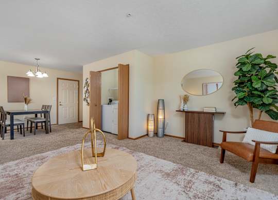 A living room with a brown chair and a wooden coffee table.
