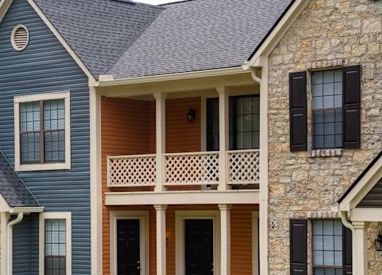 A house with a blue siding and a brown door.