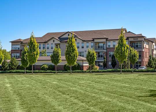 A large building with the number 0630 on it is surrounded by trees.