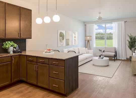 Altura Apartments oversized kitchen featuring a breakfast bar with seating and granite countertops.
