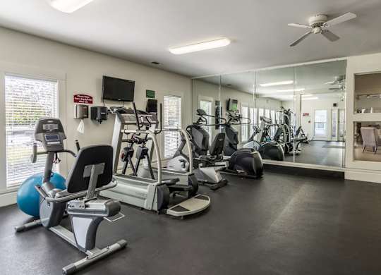 24-hour fitness center at Britton Woods Apartments in Dublin, Ohio, featuring free weights and cardio machines