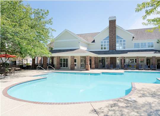 Sparkling swimming pool and sundeck at Britton Woods Apartments with updated community amenities