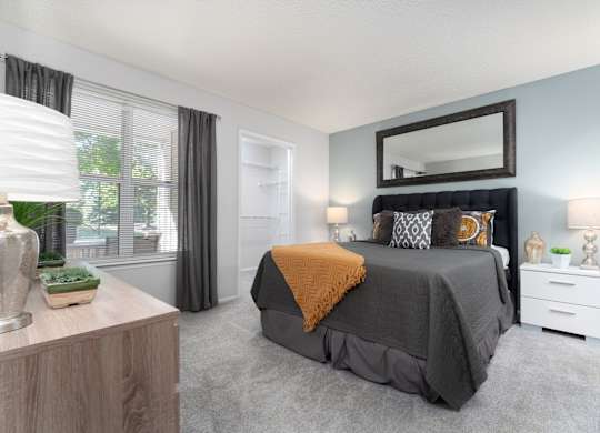 Spacious bedroom with a king-sized bed at Britton Woods Apartments in Dublin, Ohio