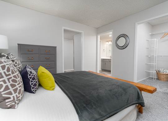 Bedroom with an en suite bathroom and closet space in a Britton Woods apartment