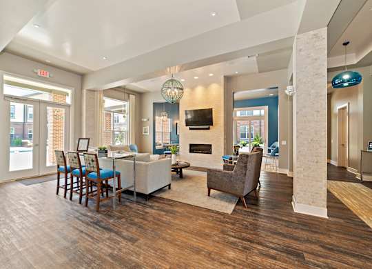 The updated and renovated clubhouse features a game room with a pool table, a full kitchen, and a coffee bar with comfortable seating.