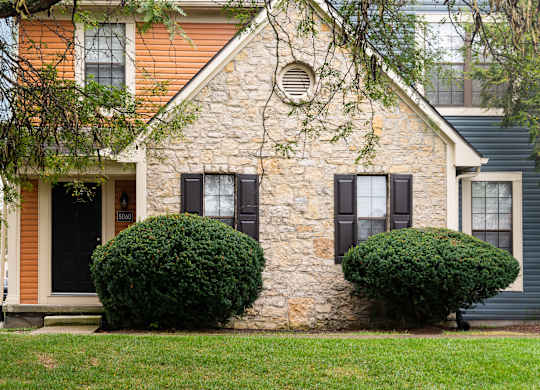 Fairway Lakes exterior featuring a tree and landscaped grounds.