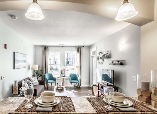 A well-lit dining area with a table set for two.
