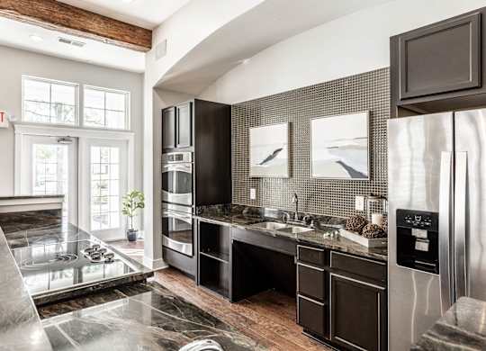 A modern kitchen with a black and white color scheme.