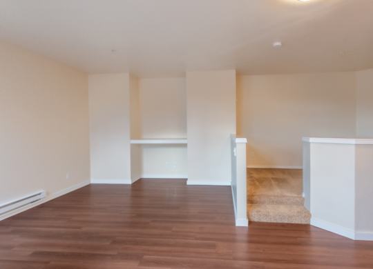 A room with wooden floors and white walls.