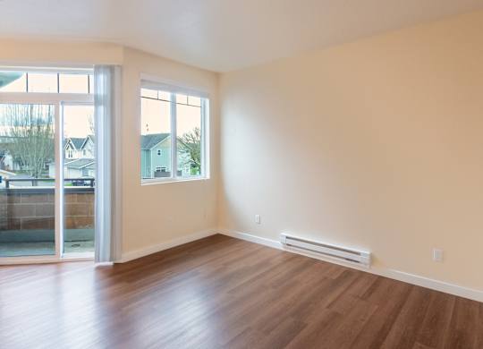 A room with a sliding glass door and a window.
