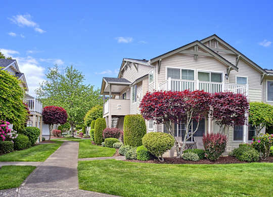 community exterior with lush landscaping and side walks at Clock Tower Village, DuPont