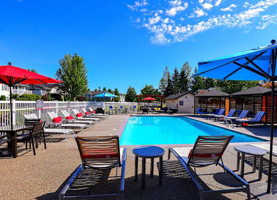 pool with lounge chairs at Clock Tower Village, Washington, 98327