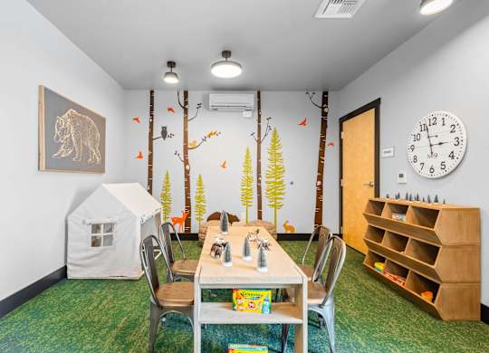 a play room with a table and a tent
