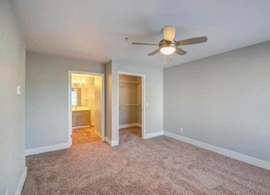 Spacious Bedroom with Ceiling Fan, and Attached Bathroom at Clock Tower Village, DuPont, WA 98327
