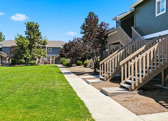 A row of wooden staircases lead up to the front doors of houses.