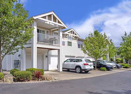 Community exterior with attached garages at Clock Tower Village, DuPont Washington