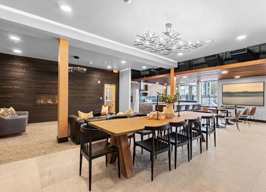 a dining area with tables and chairs and a fireplace