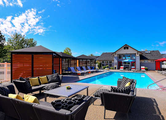 pool with lounge chairs at Clock Tower Village, DuPont, WA 98327