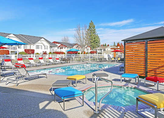 pool and spa with lounge chairs at Clock Tower Village, DuPont Washington