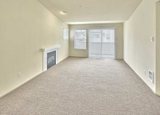 living area with fireplace and attached balcony at Clock Tower Village, DuPont, WA 98327