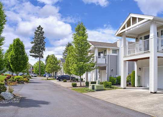 community exterior with parking and balconies at Clock Tower Village, DuPont, WA 98327