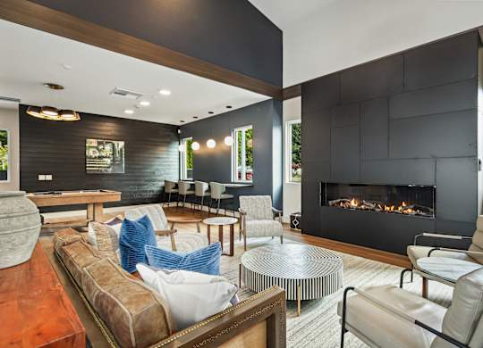 A modern living room with a fireplace and a couch.