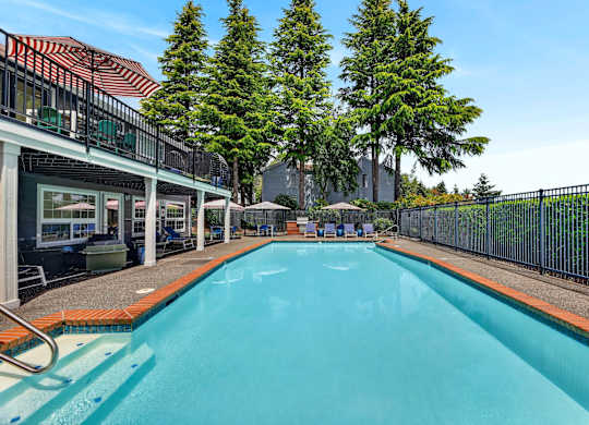A swimming pool with a fence around it.