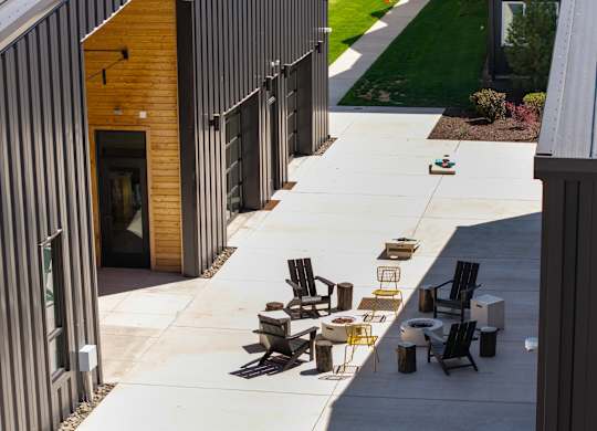 A patio area with a table and chairs is shown.