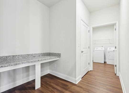 A laundry room with a washer and dryer.