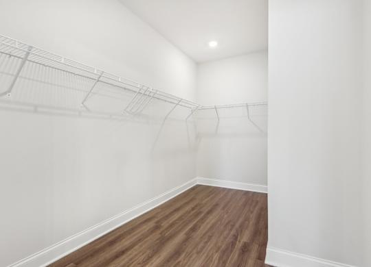 A room with a wooden floor and white walls.