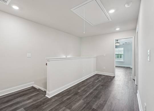 Loft area ideal for family gatherings just steps from the upstairs bedrooms.