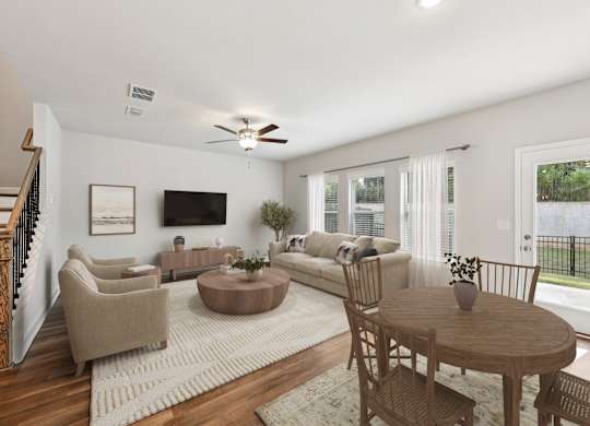 Living room with large window letting in a ton of natural light.