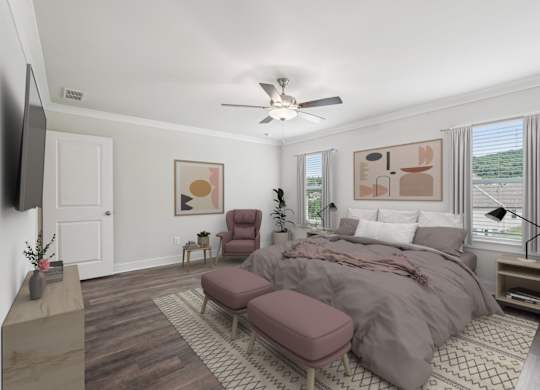 Primary bedroom with king size bed and large window letting in nice natural light.