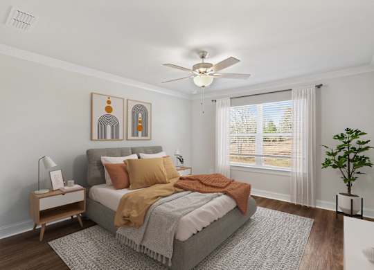 Primary Bedroom with king size bed and large window letting in nice natural light.