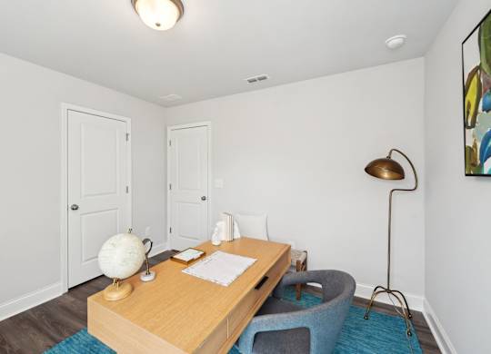 A room with a desk and chair.